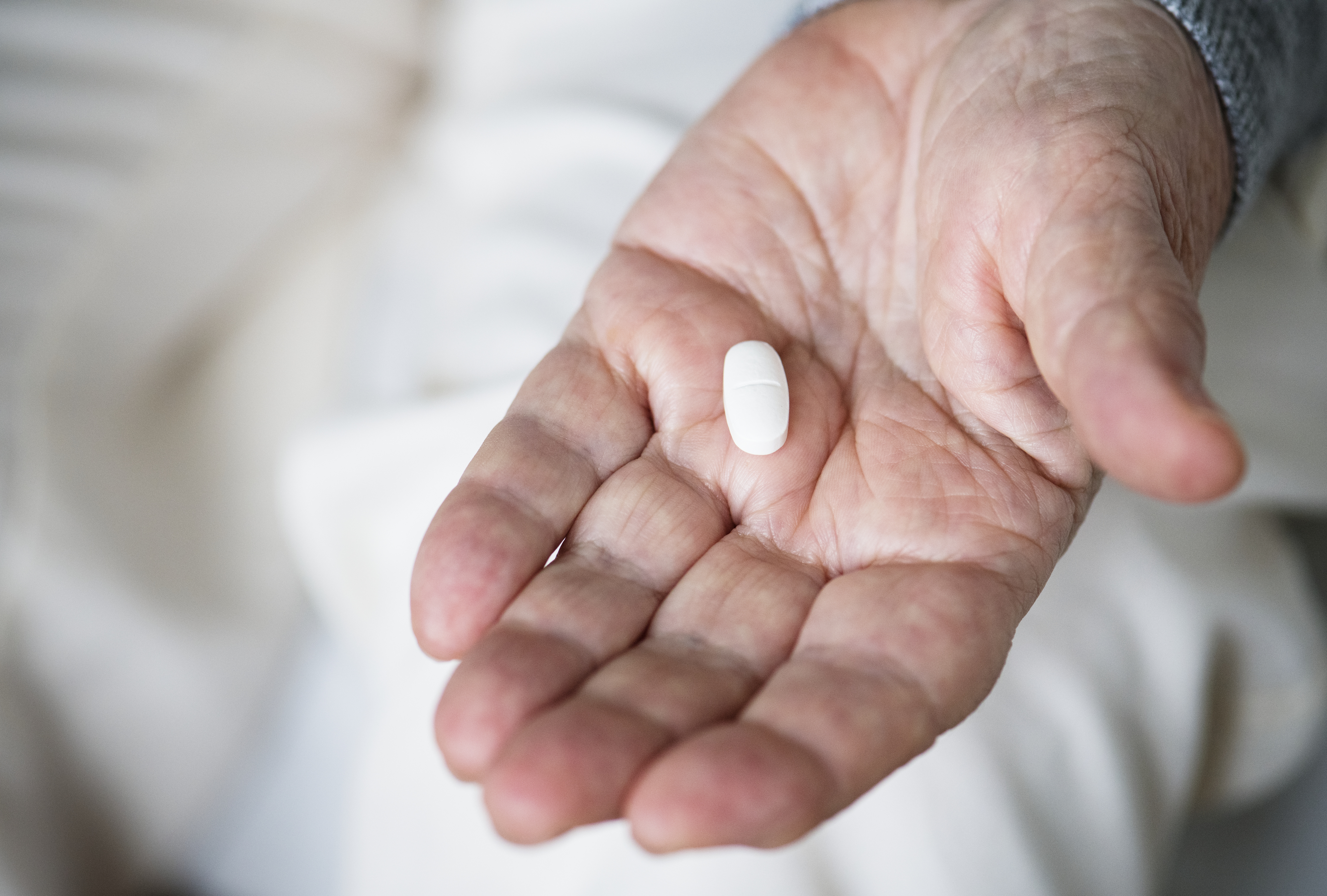 Elderly woman taking a medicine