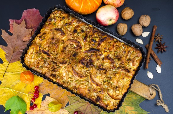 Homemade apple pie with nuts and pumpkin seeds.